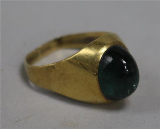 An 18ct gold and green cabochon ring, size O.